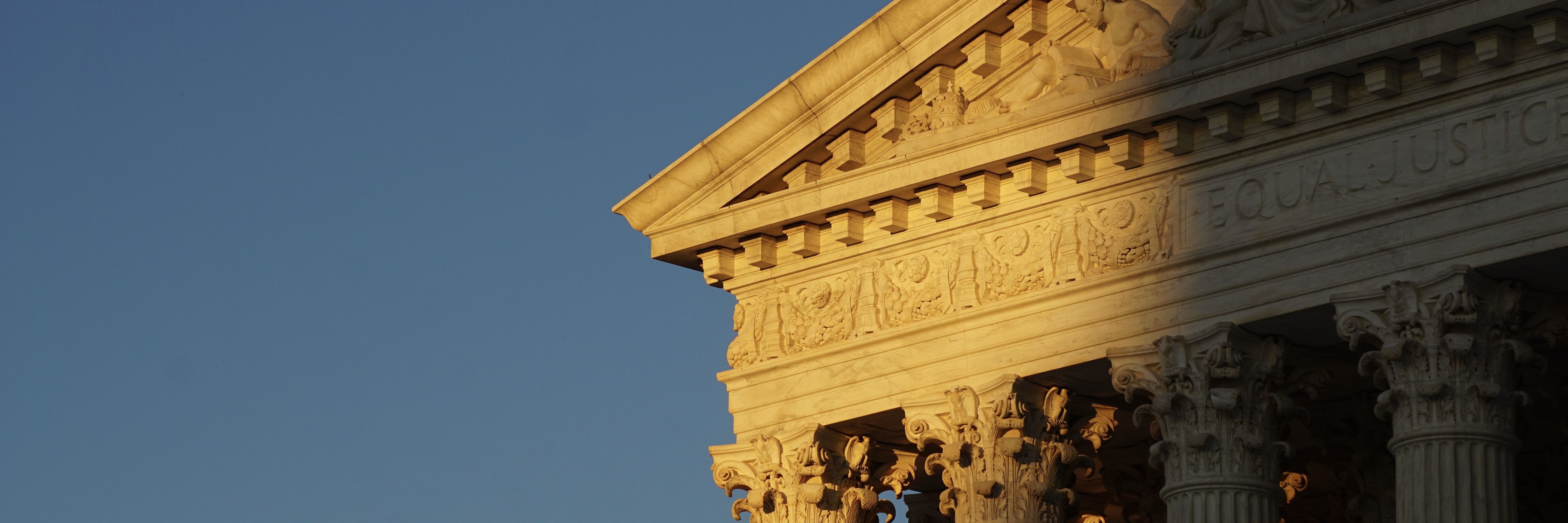 Close-up of the Supreme Court building at sunset